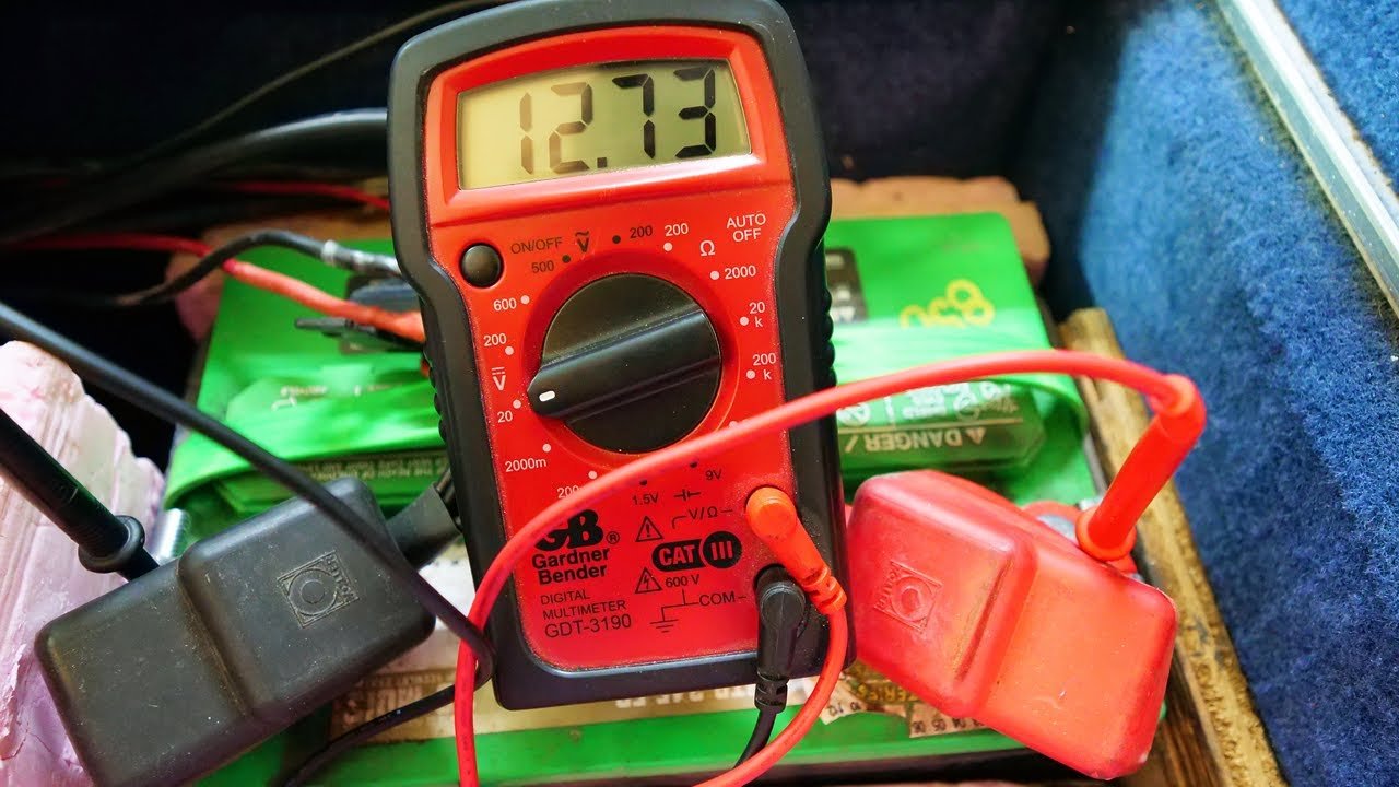 multimeter testing battery voltage solar system