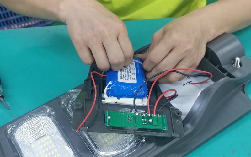 solar street light installation with battery compartment open